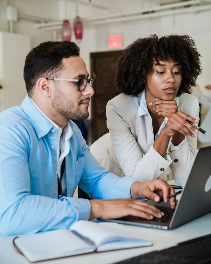 Two colleagues reviewing a project